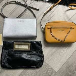 Three Michael Kors bags